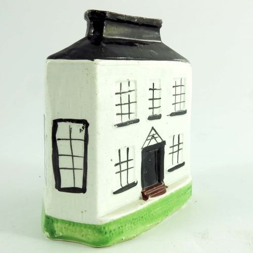 1568 - A Staffordshire Bank money box, circa 1815, relief moulded and painted, 11.5cm high