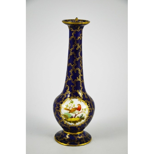 1576 - A porcelain sprinkler bottle, elongated baluster form with ogee foot, gilt over blue seaweed ground ... 