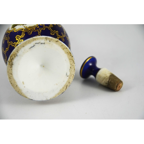 1576 - A porcelain sprinkler bottle, elongated baluster form with ogee foot, gilt over blue seaweed ground ... 