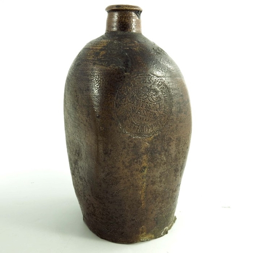 1581 - A stoneware bottle and a 16th century green glazed pot, 20cm high (2)