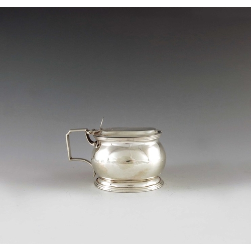 2038 - AK, London 1808, a George III silver barrel-shaped oval mustard pot of plain form with thread edged ... 