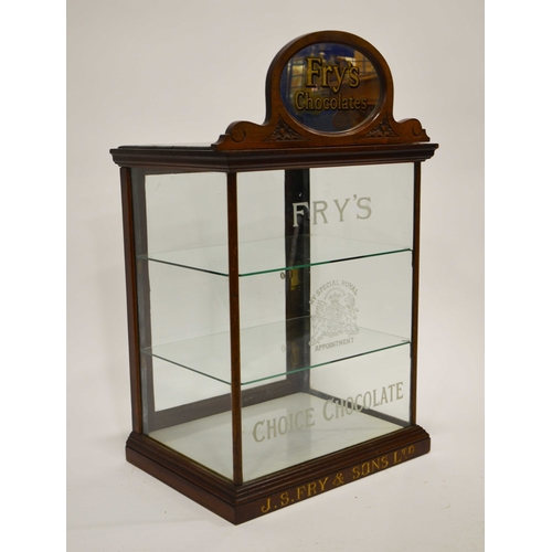 819 - An early 20th century mahogany and glass shop display cabinet, with oval mirrored pediment and adver... 