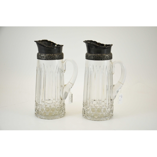 11 - A pair of white metal mounted cut glass beer or lemonade jugs, probably German, circa 1920s, conical... 