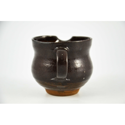 1428 - Margaret Leach for Wye Valley, a studio pottery jug, brown treacle glaze, impressed mark, 9cm high