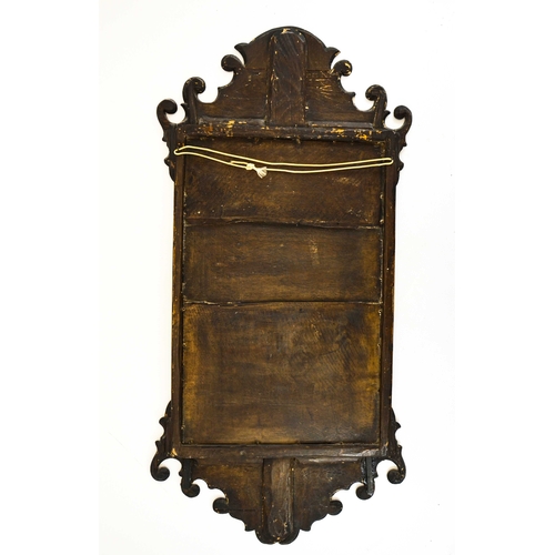 238 - A George II mahogany fretwork mirror, shaped scrolling pediment and skirt, glass 50cm x 32cm, overal... 