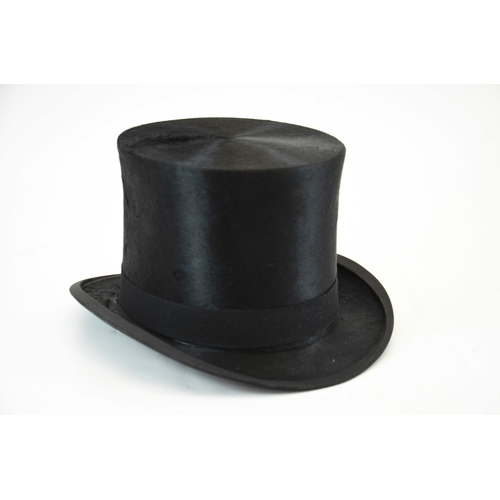 523 - A Woodrow and Sons black silk top hat, in Morrocan leather and silk lined leather hat box, 20.5cm x ... 