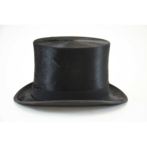 523 - A Woodrow and Sons black silk top hat, in Morrocan leather and silk lined leather hat box, 20.5cm x ... 