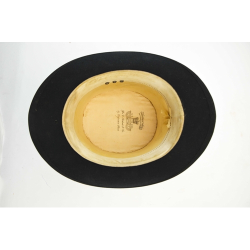 523 - A Woodrow and Sons black silk top hat, in Morrocan leather and silk lined leather hat box, 20.5cm x ... 