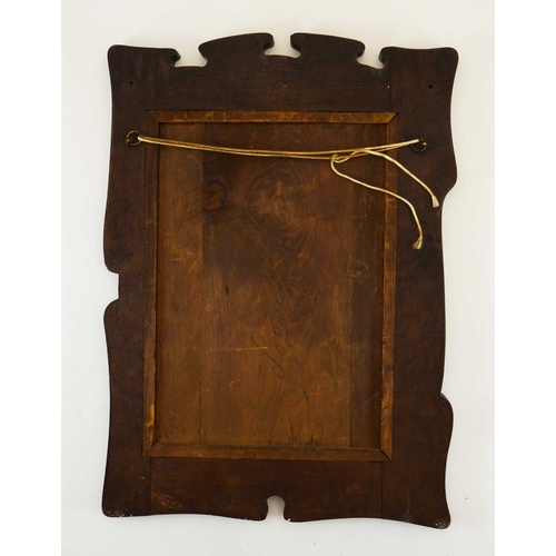 581 - An Arts and Crafts walnut and patinated copper mirror, asymetrical fretted with applied planished ro... 