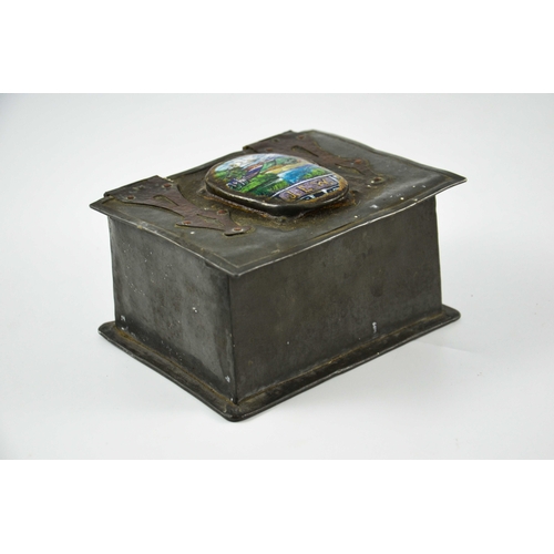 619 - An Arts and Crafts pewter and copper casket set with an enamelled roundel, oval landscape view with ... 