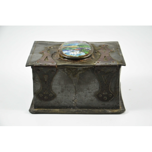 619 - An Arts and Crafts pewter and copper casket set with an enamelled roundel, oval landscape view with ... 