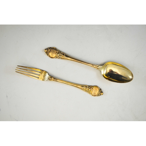 77 - A Victorian silver christening set, John Gammage, Birmingham 1891, cast fork and spoon, in velvet li... 