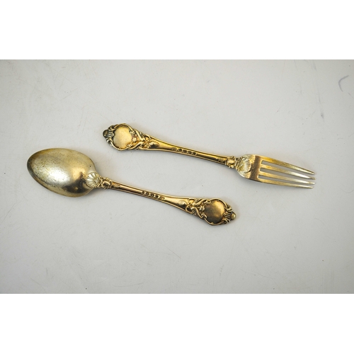 77 - A Victorian silver christening set, John Gammage, Birmingham 1891, cast fork and spoon, in velvet li... 