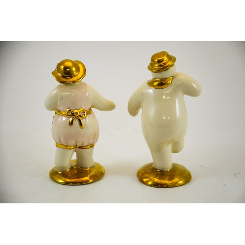 893 - Two Royal Doulton snowmen figures,  Lady Snowman and The Snowman, gold and silver highlights colourw... 