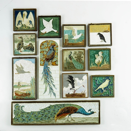 1012 - A collection of Dutch Delft 'cloisonne' tiles, circa 1950, all decorated with various birds, peacock... 