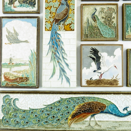 1012 - A collection of Dutch Delft 'cloisonne' tiles, circa 1950, all decorated with various birds, peacock... 