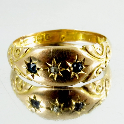 119 - A 9ct yellow gold Gypsy Ring, inset with three stones, hallmarked