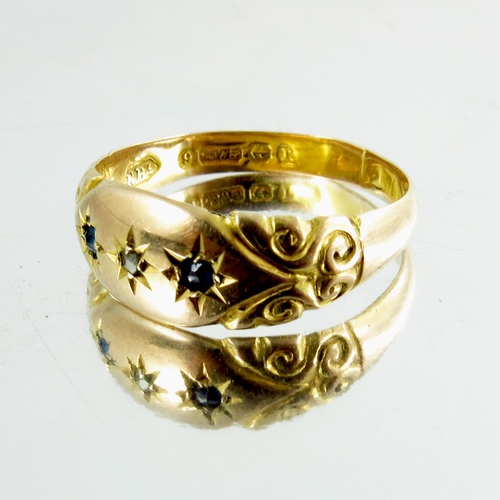 119 - A 9ct yellow gold Gypsy Ring, inset with three stones, hallmarked