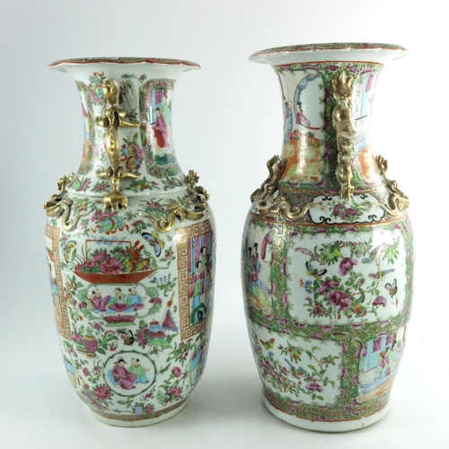 401 - A large matched pair of Chinese famille rose vases, 19th century or earlier, shouldered form with re... 