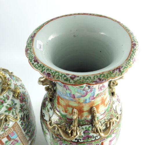 401 - A large matched pair of Chinese famille rose vases, 19th century or earlier, shouldered form with re... 