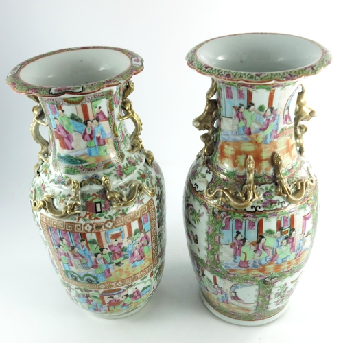 401 - A large matched pair of Chinese famille rose vases, 19th century or earlier, shouldered form with re... 