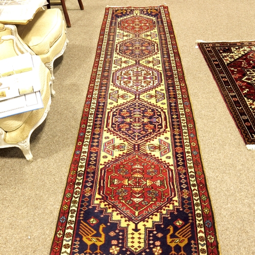 514 - A Kazak cream, blue and crimson corridor runner, 79cm x 320cm