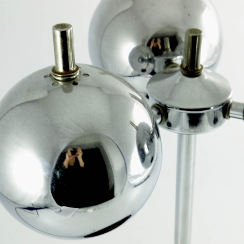 583 - A Modernist chrome and lacquered metal lamp, circa 1950s, the central post supporting a three arm br... 