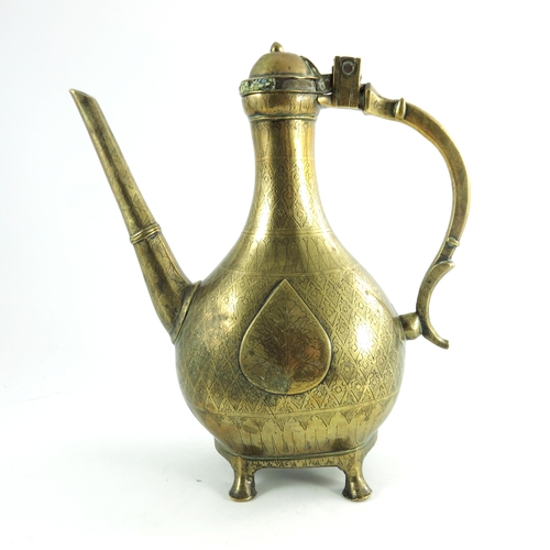 596 - An 18th century Mughal ewer or coffee pot (Aftaba), cast brass with engraved decoration, probably Pu... 