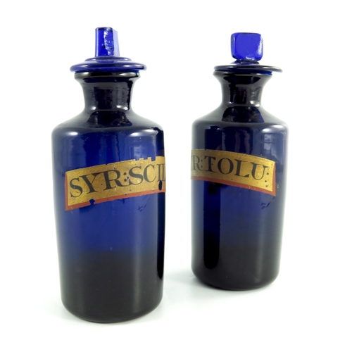 788 - A pair of 19th century Apothecary bottles, in cobalt blue with stoppers and gold labels SYR:TOLU and... 