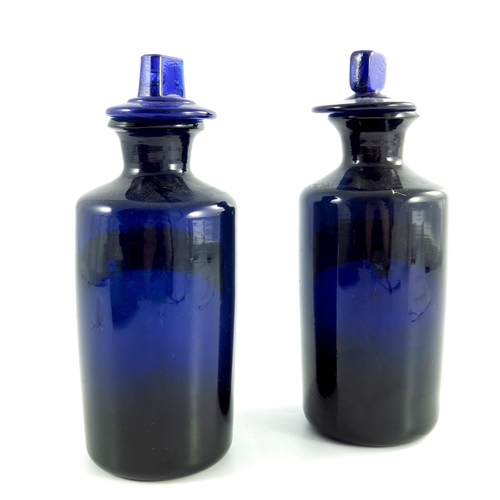 788 - A pair of 19th century Apothecary bottles, in cobalt blue with stoppers and gold labels SYR:TOLU and... 