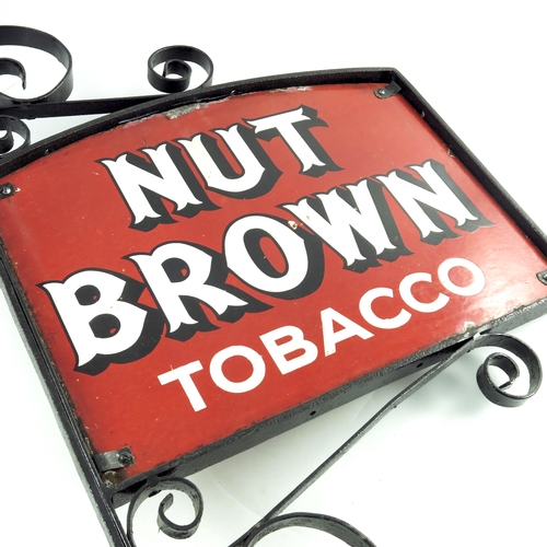 801 - A double sided enamel sign for NUT BROWN TOBACCO, within an iron frame, sign 46cm x 34.5cm, frame 81... 