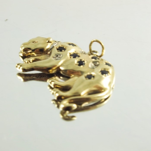 147 - A 9ct yellow gold leopard pendant, styled in prowling pose and inset with diamonds and sapphires (un... 