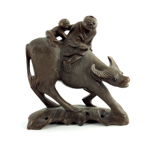 478 - Three wood carved Chinese figures, depicting a pair of sages and a parent and child riding a buffalo... 