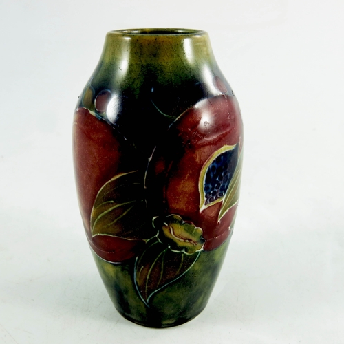 1166 - William Moorcroft, a miniature Pomegranate on ochre vase, circa 1914, shouldered form, impressed Bur... 