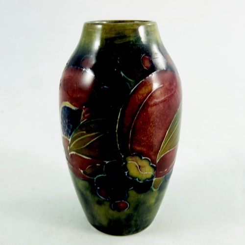 1166 - William Moorcroft, a miniature Pomegranate on ochre vase, circa 1914, shouldered form, impressed Bur... 