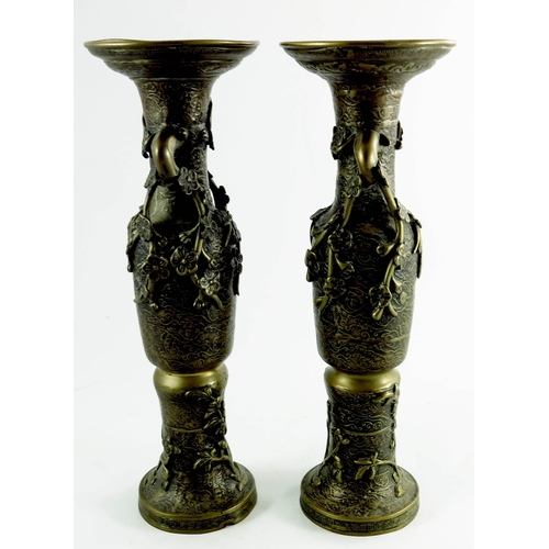 473 - A pair of Oriental bronze vases, relief moulded prunus decoration, 41cm high (2)