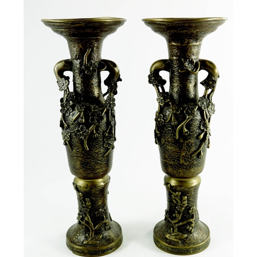 473 - A pair of Oriental bronze vases, relief moulded prunus decoration, 41cm high (2)