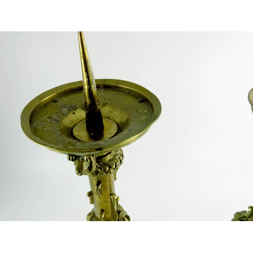 595 - A pair of Spanish style brass pricket sticks, triangular bases, cast and pierced in the early Gothic... 