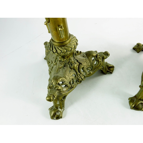 595 - A pair of Spanish style brass pricket sticks, triangular bases, cast and pierced in the early Gothic... 