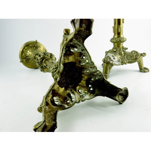 595 - A pair of Spanish style brass pricket sticks, triangular bases, cast and pierced in the early Gothic... 