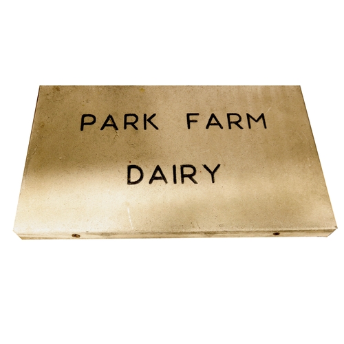 810 - A limestone slab with engraved PARK FARM DAIRY (Malvern area?), 26cm x 45.5cm x 3.2cm