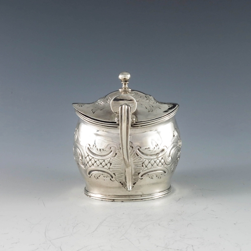 2011 - John Gold, London 1801, a George III silver mustard pot of navette form, the body with moulded and c... 