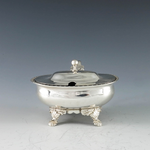 2013 - Thomas Dicks, London 1818, a George III silver oval mustard pot raised on shell scroll feet, gadroon... 