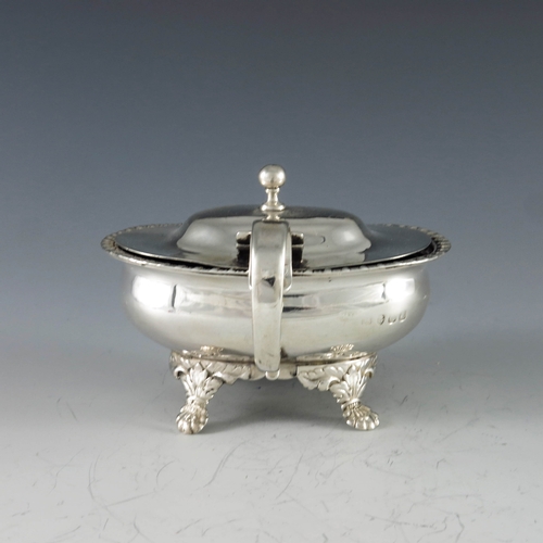 2013 - Thomas Dicks, London 1818, a George III silver oval mustard pot raised on shell scroll feet, gadroon... 