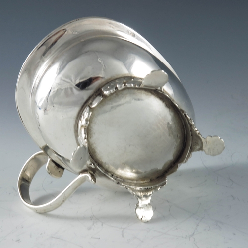 2013 - Thomas Dicks, London 1818, a George III silver oval mustard pot raised on shell scroll feet, gadroon... 