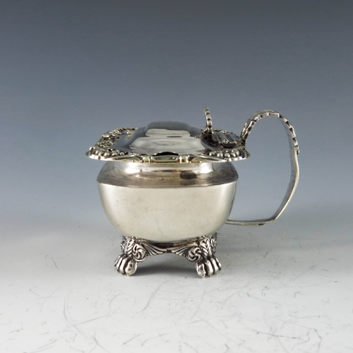 2014 - Solomon Hougham, London 1817, a George III silver mustard pot, of rectangular form, the plain body r... 