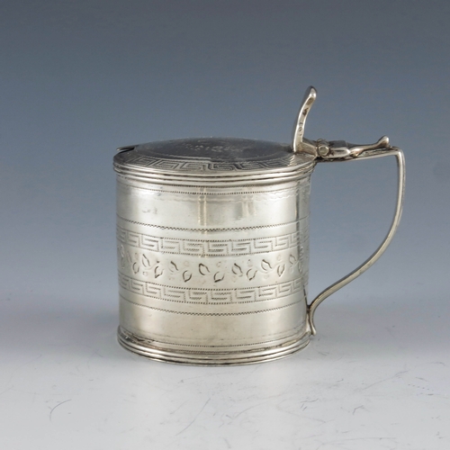 2022 - Alexander Field, London 1807, a George III silver mustard pot, of cylindrical form, chased with a fo... 