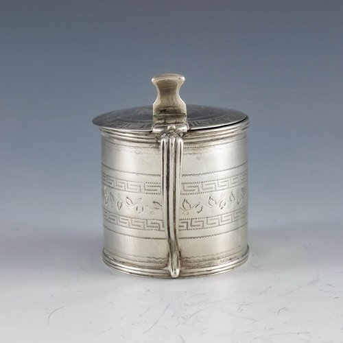 2022 - Alexander Field, London 1807, a George III silver mustard pot, of cylindrical form, chased with a fo... 