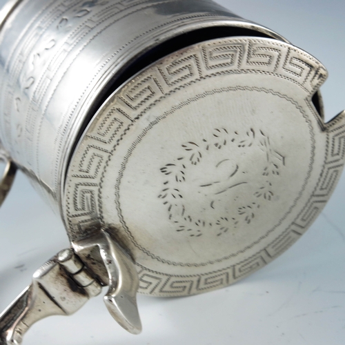 2022 - Alexander Field, London 1807, a George III silver mustard pot, of cylindrical form, chased with a fo... 