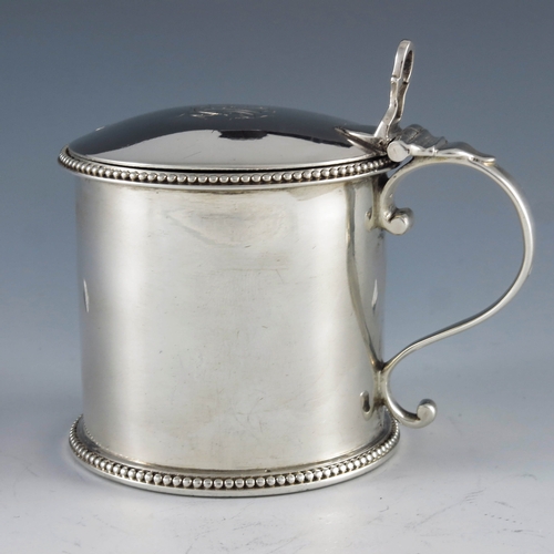 2024 - Thomas Daniel, London 1783, a George III silver straight sided cylindrical mustard pot with beaded b... 